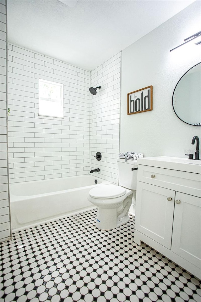 full bathroom with washtub / shower combination, vanity, and toilet