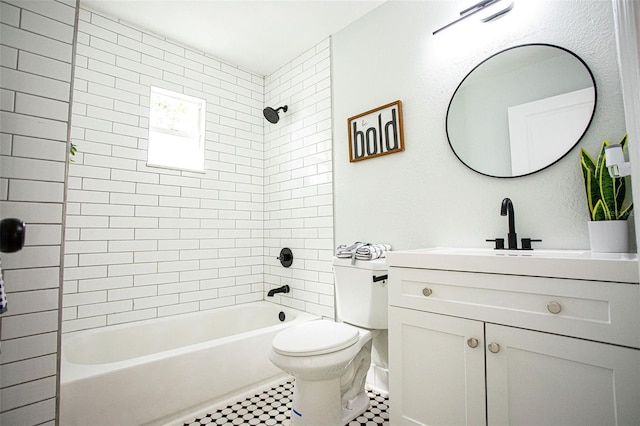 bathroom featuring bathing tub / shower combination, toilet, and vanity