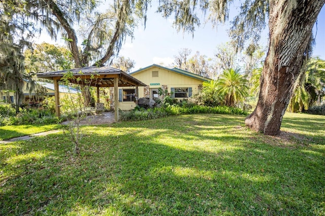 view of yard with a carport and a gazebo