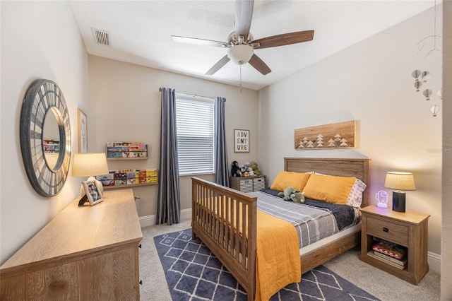 bedroom featuring baseboards, carpet floors, visible vents, and a ceiling fan