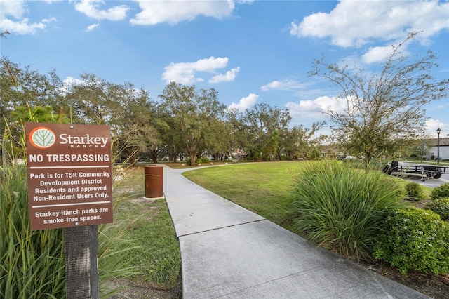 view of home's community with a yard