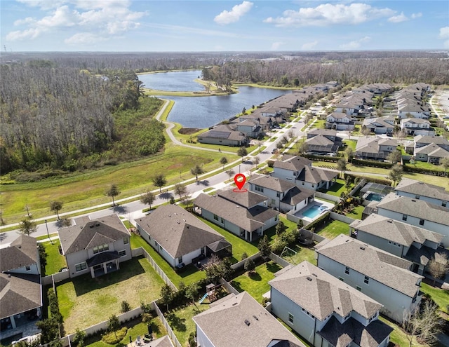 birds eye view of property with a water view and a residential view