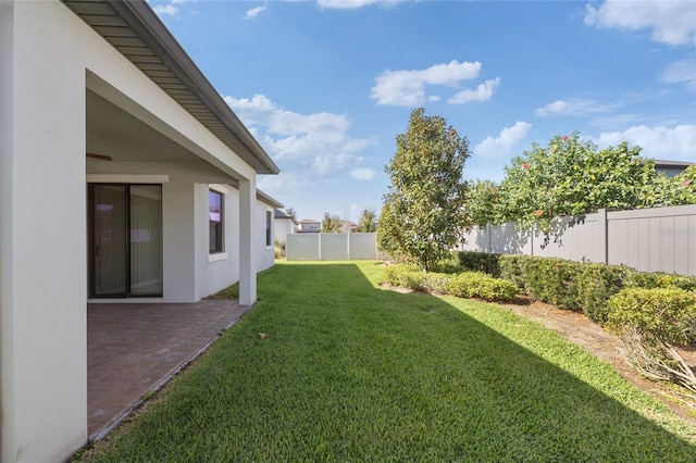 view of yard with a fenced backyard and a patio area