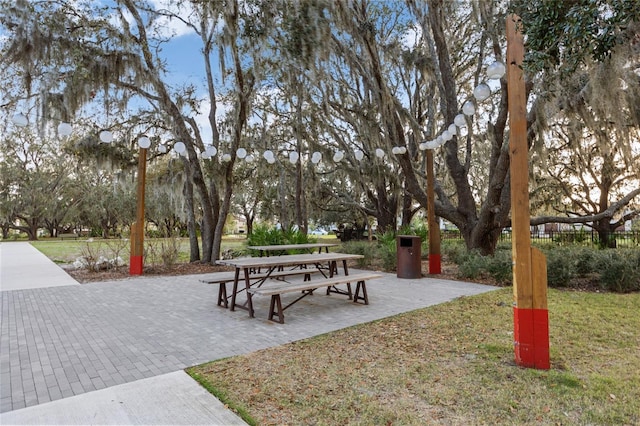 view of community with a patio and a yard