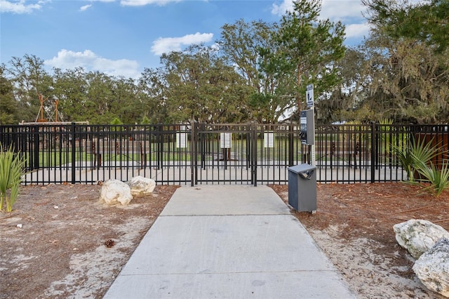 view of gate with fence