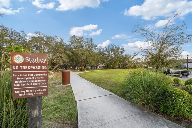 surrounding community featuring a yard