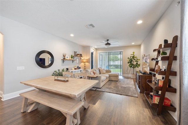 dining space with baseboards, ceiling fan, dark wood-style flooring, and visible vents