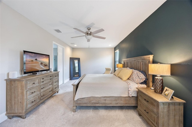bedroom with visible vents, baseboards, ceiling fan, and light colored carpet