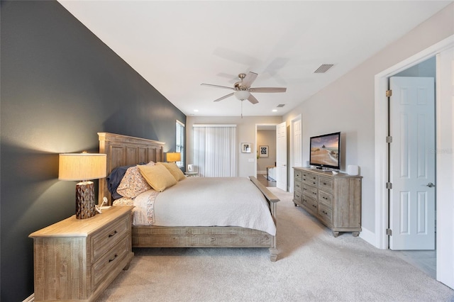 bedroom featuring a ceiling fan, baseboards, visible vents, and light carpet