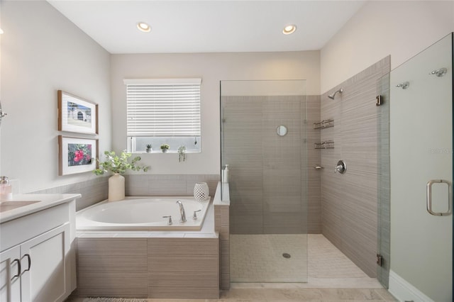 full bath featuring a garden tub, recessed lighting, a stall shower, and vanity