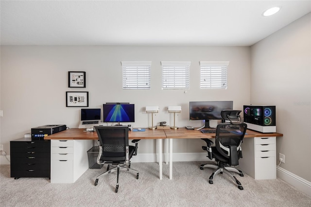 carpeted home office featuring baseboards