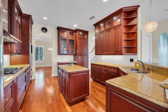 kitchen with a sink and dark brown cabinets