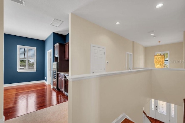 kitchen with recessed lighting, visible vents, baseboards, light countertops, and dark wood-style floors