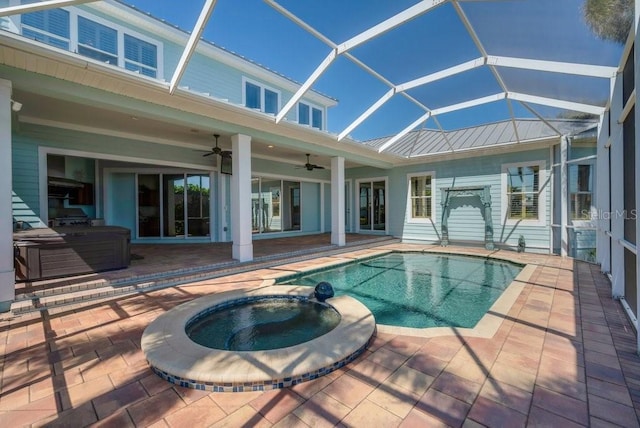 outdoor pool with a ceiling fan, a patio, and an in ground hot tub