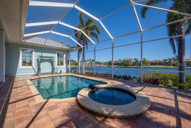 view of pool featuring a pool with connected hot tub, glass enclosure, a patio, and a water view