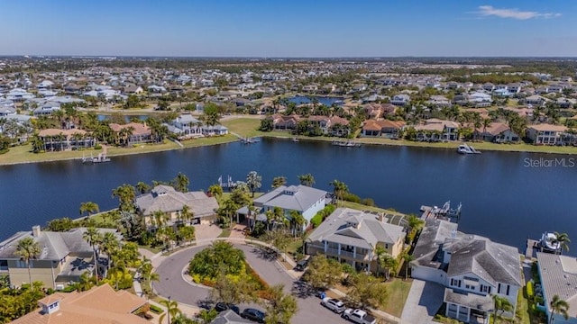 bird's eye view with a water view and a residential view