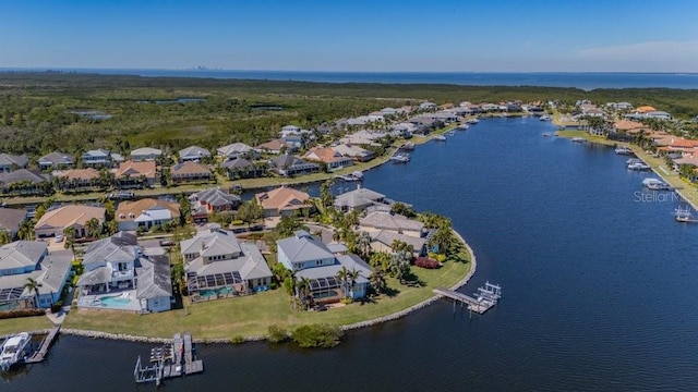 bird's eye view featuring a water view and a residential view