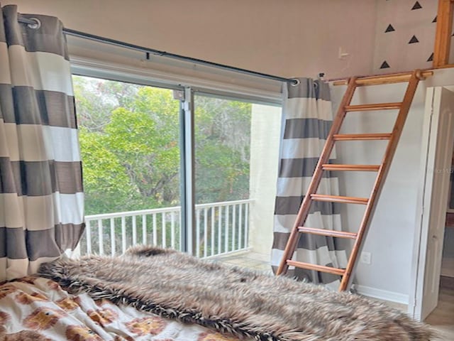 unfurnished bedroom featuring multiple windows