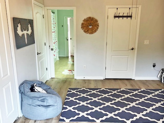 sitting room featuring wood finished floors and baseboards