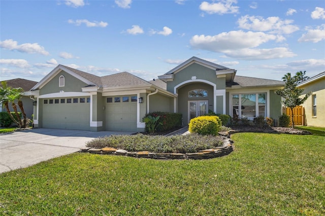 single story home with a front yard, a garage, driveway, and stucco siding