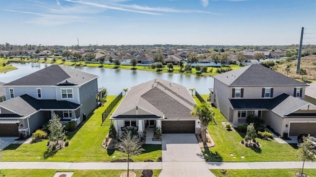 bird's eye view with a water view and a residential view