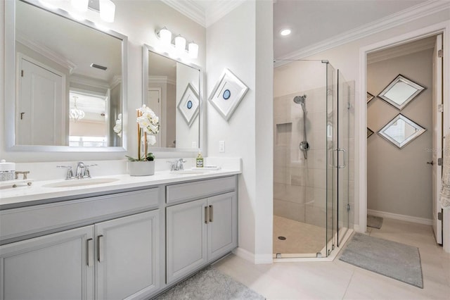 bathroom featuring ornamental molding, a sink, and a shower stall