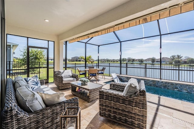 view of patio / terrace featuring glass enclosure, fence, an outdoor living space, and a water view