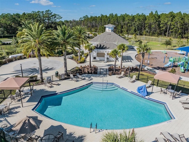 pool featuring a patio and fence