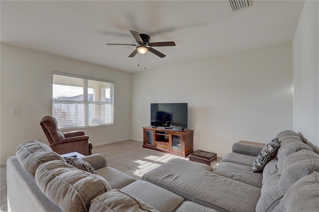 living room featuring light carpet, baseboards, visible vents, and a ceiling fan