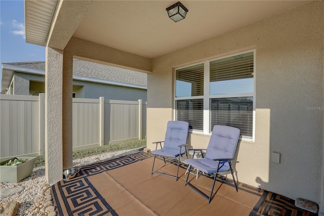 view of patio featuring fence