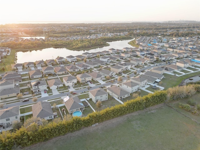 bird's eye view featuring a water view and a residential view