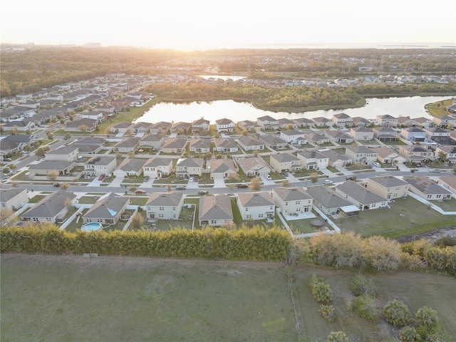 bird's eye view with a water view and a residential view