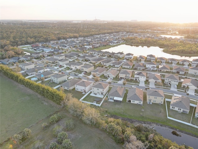 bird's eye view with a water view and a residential view