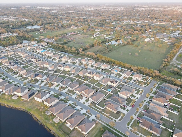 aerial view with a residential view and a water view