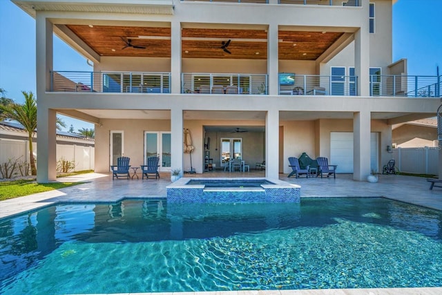 rear view of property with a patio area, ceiling fan, fence, and stucco siding