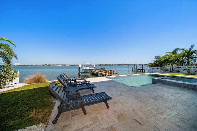 view of swimming pool with boat lift, a water view, a patio area, fence, and a dock