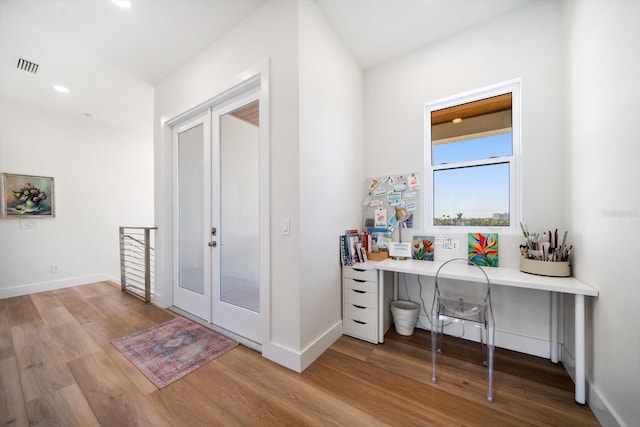 office with recessed lighting, visible vents, baseboards, and wood finished floors