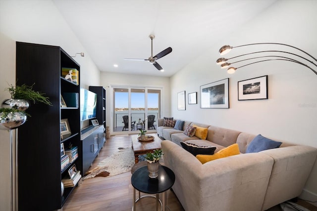 living area featuring ceiling fan and light wood-style flooring