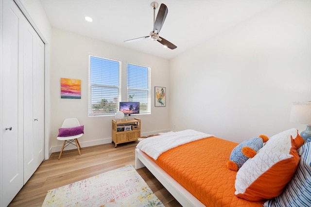 bedroom featuring baseboards, a ceiling fan, light wood-style flooring, a closet, and recessed lighting