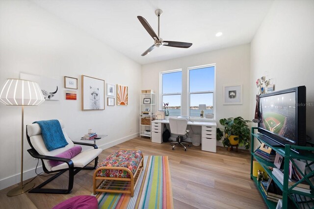 office area with light wood-style flooring, baseboards, ceiling fan, and recessed lighting