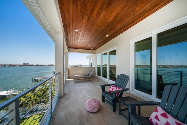 balcony featuring a water view