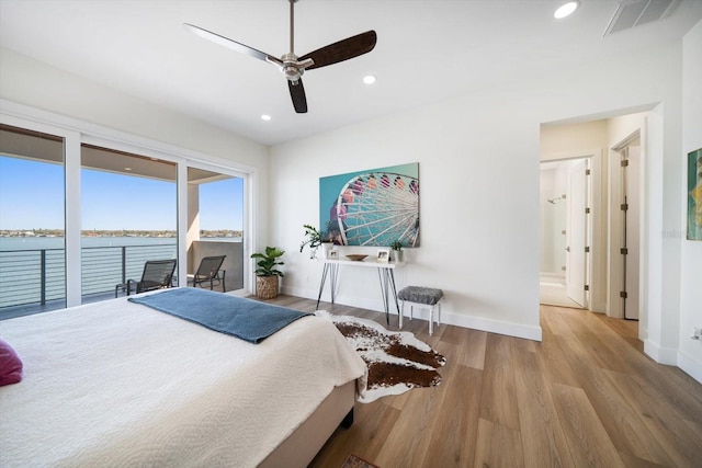 bedroom featuring recessed lighting, wood finished floors, visible vents, and access to exterior