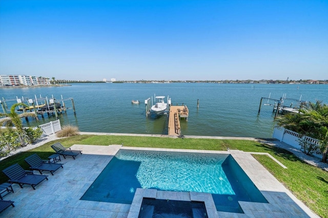 view of pool with a patio, a boat dock, a water view, fence, and a yard