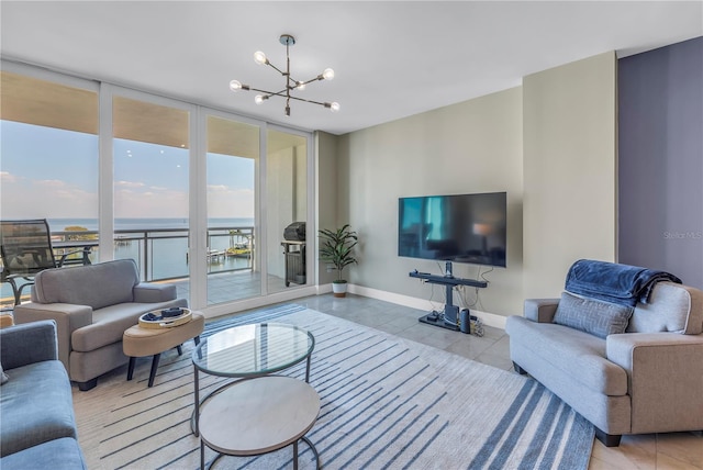 tiled living room with a wall of windows, baseboards, and an inviting chandelier