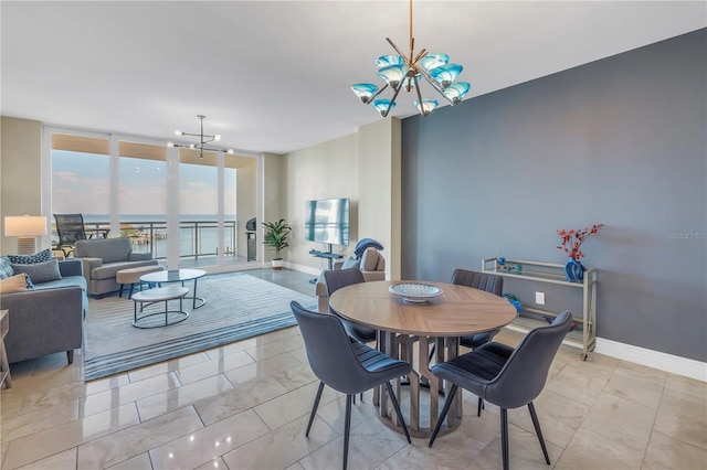 dining space with a chandelier, floor to ceiling windows, and baseboards