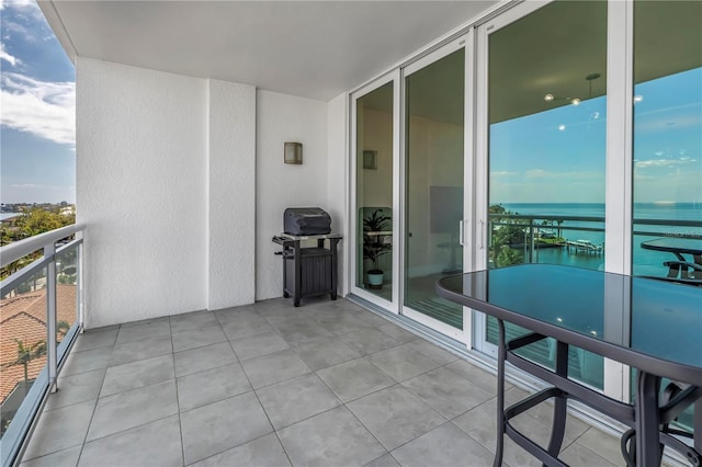 balcony featuring a water view