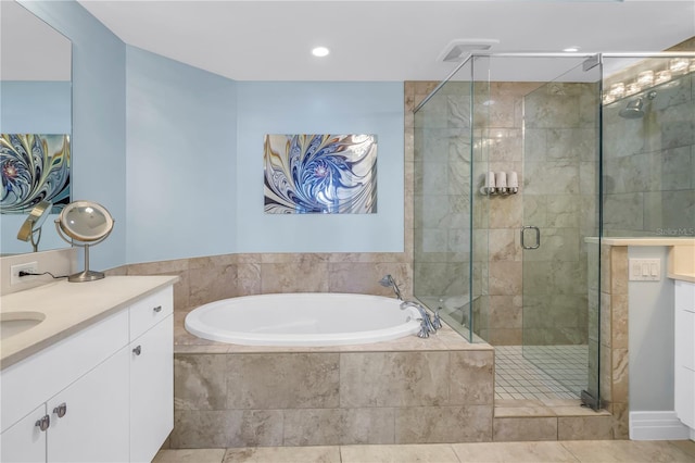 full bathroom with recessed lighting, a garden tub, a shower stall, and vanity