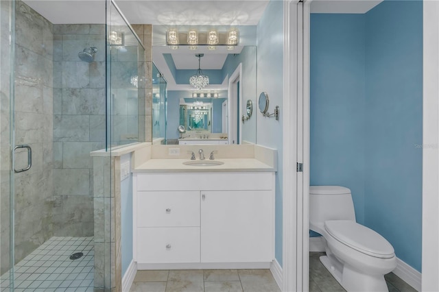 bathroom featuring baseboards, a shower stall, toilet, and vanity