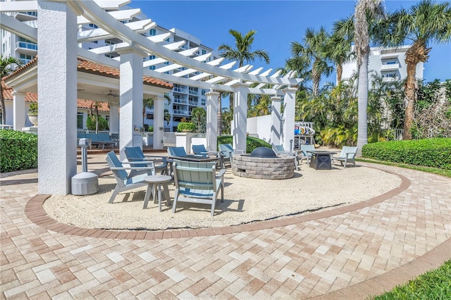 view of patio featuring a fire pit and a pergola