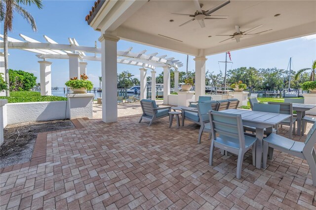 view of patio / terrace featuring ceiling fan, outdoor dining area, and a pergola